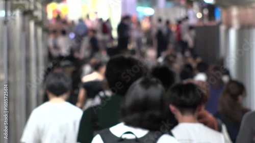 Wallpaper Mural TOKYO, JAPAN - AUG 2025 : Time lapse shot of crowd of people walking at busy downtown area in busy night rush hour. Japanese people, urban city life and lifestyle concept video. Torontodigital.ca