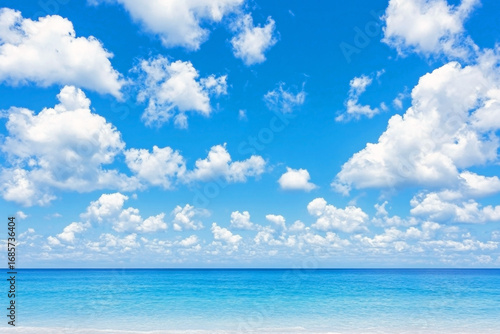 Wallpaper Mural Bright blue sky with scattered fluffy white clouds over calm turquoise sea, clear horizon dividing water and sky Torontodigital.ca