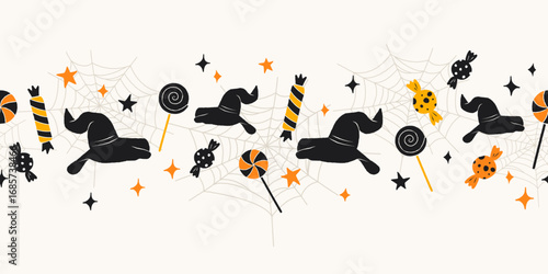 Halloween seamless border with cute witch hats, candies, lollipops, stars, and spider webs on light background. Halloween trick or treat and holiday decoration concept
