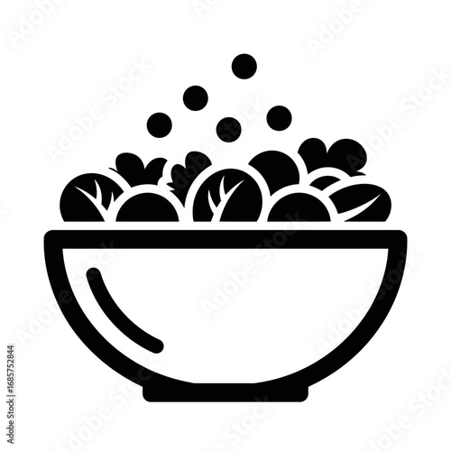 Vector art of a simple black and white icon of a bowl filled with salad and some dots representing seasoning or dressing falling from above