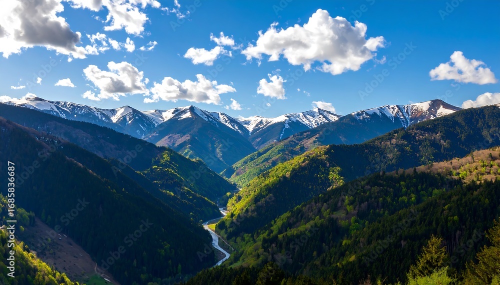 Obraz premium A breathtaking vista of snow-capped mountains and lush green valleys, showcasing a winding river carving its way through the landscape.