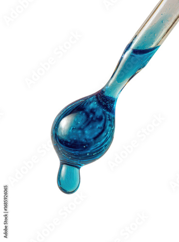 A close-up of a dripping blue liquid from a glass dropper.  The liquid is a vibrant, deep blue, almost turquoise, and forms a teardrop shape