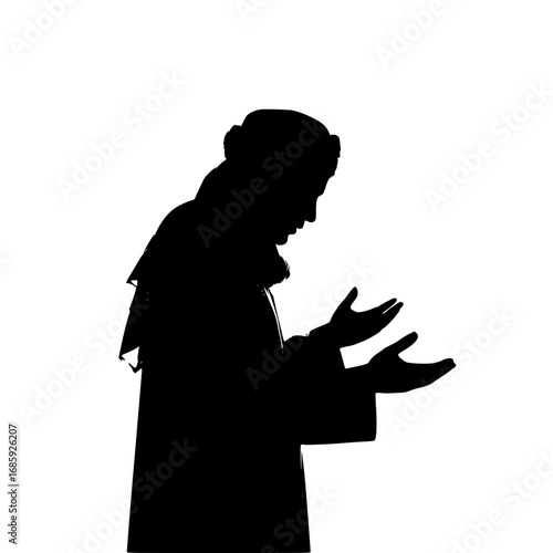 Silhouette of Man in Traditional Clothing Praying with Hands Raised Upwards