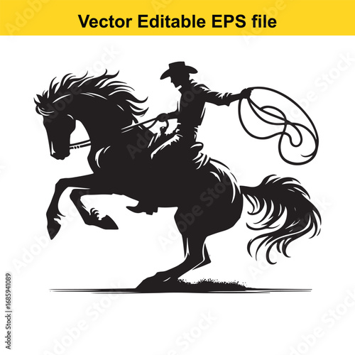 Silhouette of a cowboy riding a bucking horse with a lasso