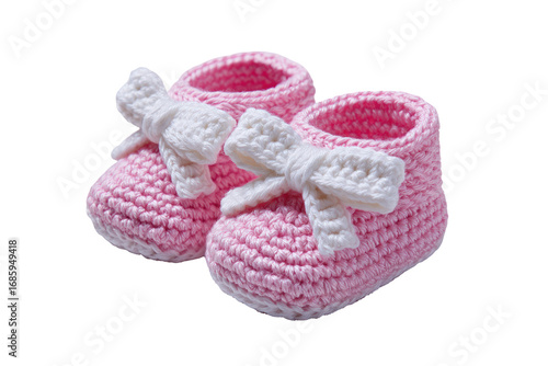 Pair of crocheted baby booties.  Pink, textured knit, with white bows