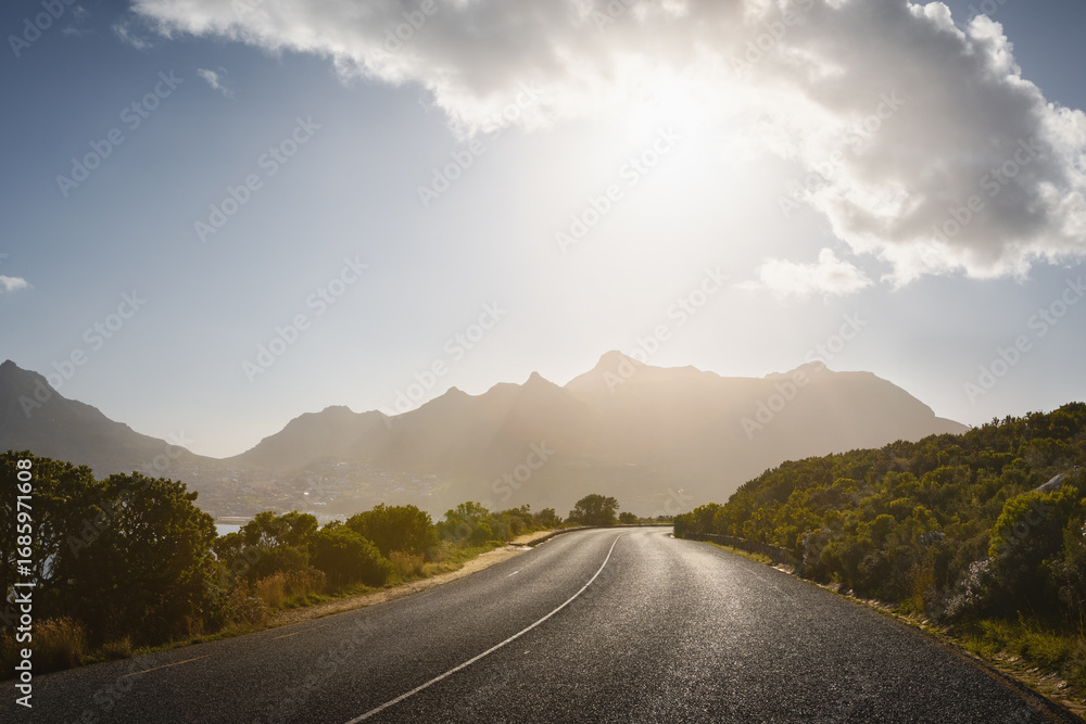 Fototapeta premium Scenic road along Ocean and Mountains at sunset. Chapman’s Peak Drive.