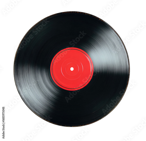 Close-up of a black vinyl record with a bright red center label, showing motion blur