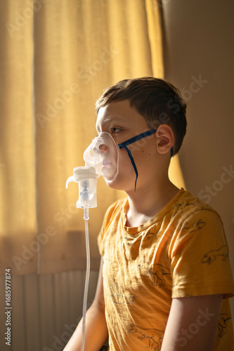 Boy using a nebulizer inhaler at home. Concept of medical treatment for asthma, flu or respiratory issues at home.Generated image