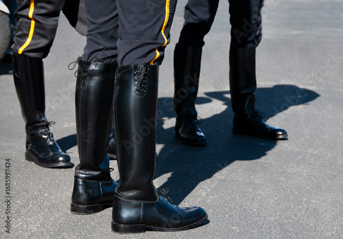 Detail image of police officer dress uniforms at a memorial event.