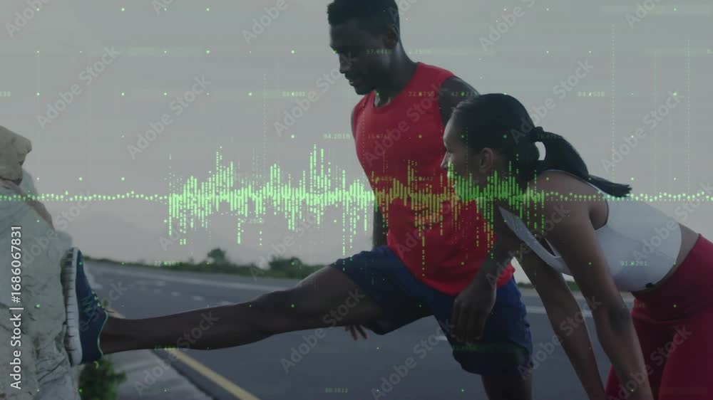 Two athletes using rock barrier performing hamstring stretches, with ...