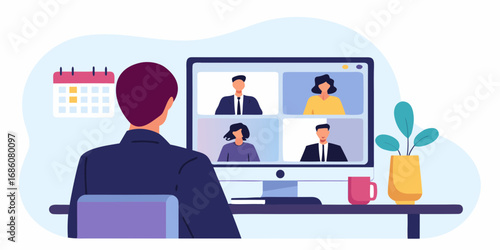 Man participating in a video conference call with colleagues on a computer screen at his desk