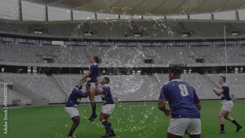 Rugby players in line-out lifting jumper after throw, passing ball with pulsing sphere overlay
