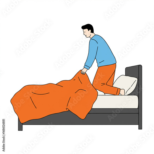 A young man making his bed in the morning, pulling up the duvet to tidy his bedroom before starting the day