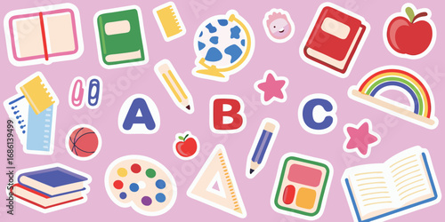 Colorful collection of school supplies and alphabet letters scattered on a pink background
