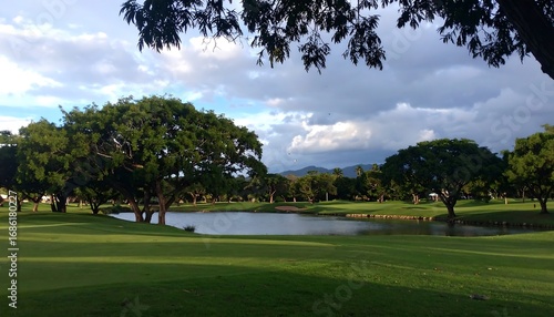 Tranquil golf course landscape under a cloudy sky