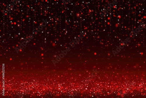 Red glitter falling on dark red background