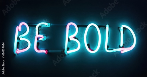 Bright neon sign displays text BE BOLD. Turquoise, pink hues illuminate dark background. Inspiring message, simple design.