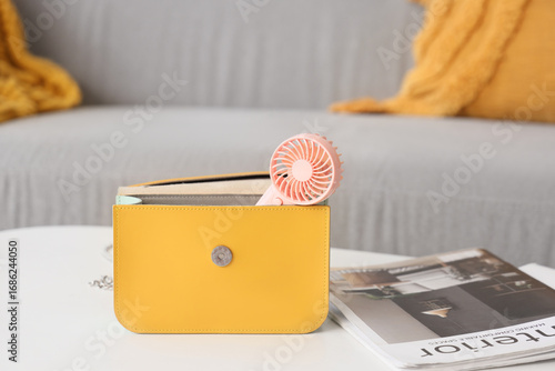 Bag with mini fan and magaz...