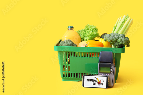 Green shopping basket with ...