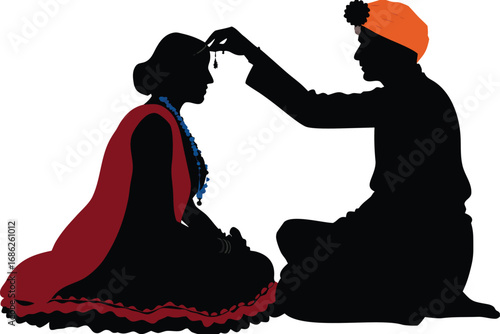Silhouette of an Indian Sikh Wedding Ceremony Depicting a Groom Blessing the Bride with a Touching and Emotional Moment