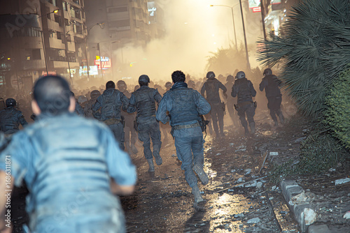 Arab protesters flee from police amid escalating tensions during nighttime unrest