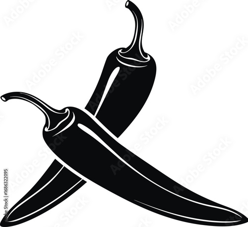 Two black chili peppers crossed isolated on white background