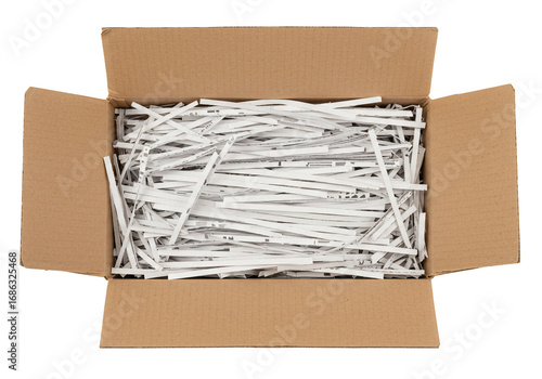 Shredded paper in cardboard box overhead view top angle