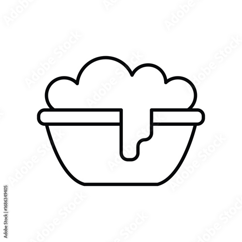 A black outline icon depicts a bowl with bubbly foam spilling over. Editable stroke. Icon vector illustration