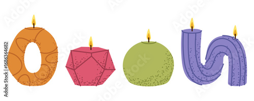 Burning candles of various shapes for holiday decor