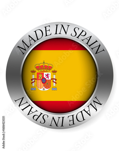 Made in Spain button icon. Circular emblem with metallic border, glossy central flag, and bilingual label indicating product origin and international manufacturing identity.