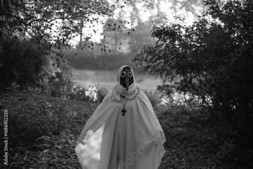 Foggy autumn landscape morning field with mysterious plague doctor