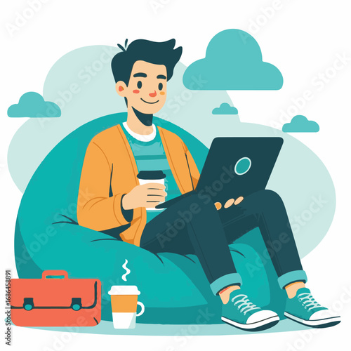 Young man working on laptop while sitting on a bean bag chair with coffee