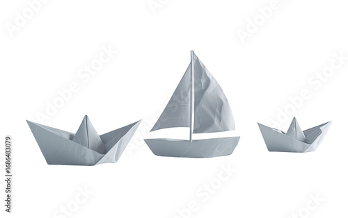 Three origami ships in a horizontal row.  Light gray/white paper craft.  Simple sail design.  One larger sailing vessel flanked by two smaller boats