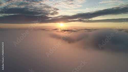 Wallpaper Mural Photorealistic depiction of the sun's brilliant glow cast upon an expansive, soft blanket of clouds from an aerial perspective, capturing a serene moment of natural beauty Torontodigital.ca