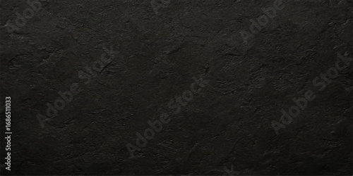 Grunge textured dark gray wall with vintage black fabric