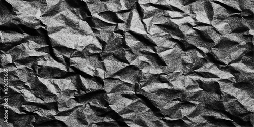 A vintage, brown, crumpled paper page with a rough, creased texture and damaged edges for a grunge backdrop