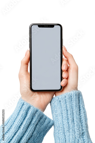 Smartphone held in light blue knit hands