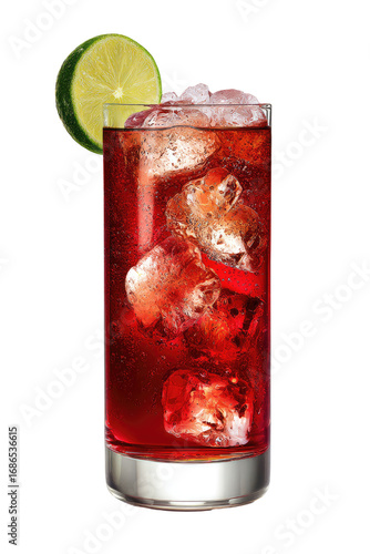 Red cocktail in tall glass with ice and lime