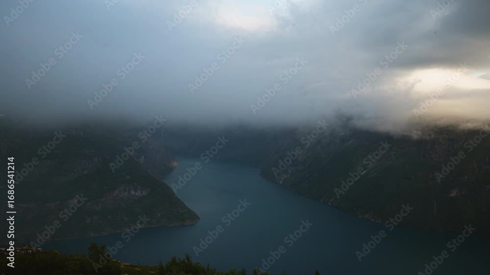 Timelapse of Geirangerfjord from Ljøsætra with the fog coming and covering the fjord Timelapse of Geirangerfjord from Ljøsætra with the fog coming and covering the fjord