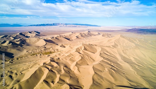 Fototapeta Naklejka Na Ścianę i Meble -  Aerial View of Warm Beige Sand Dunes with Repeating Micro-Ripples
