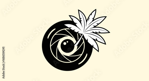 Monochrome Camera Lens Aperture with Tropical Palm Leaf.