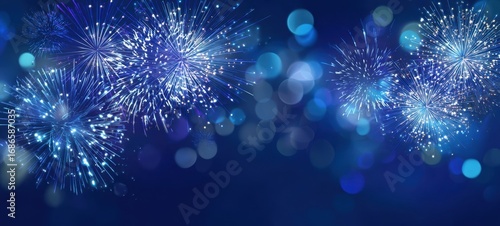 The vibrant explosion of fireworks against a blue night background.