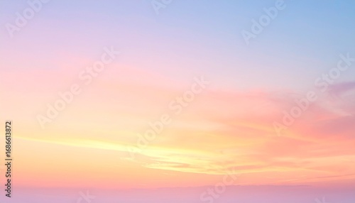 A serene sunset sky with soft pastel hues of pink, orange, and yellow blending smoothly into each other, casting a warm, peaceful glow over the horizon and evoking calmness and natural beauty.