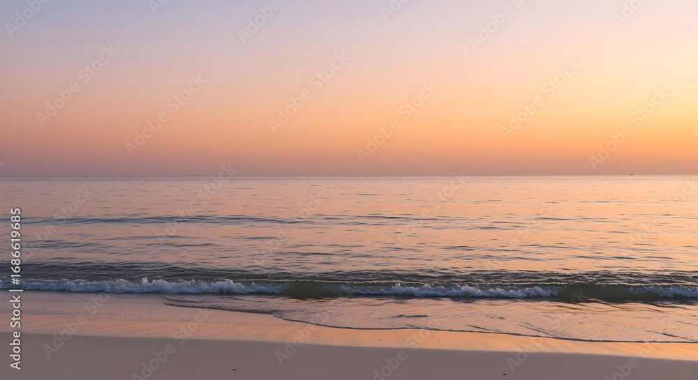 Fototapeta premium Peaceful Beach Sunset with Soft Ocean Waves and Pastel Sky