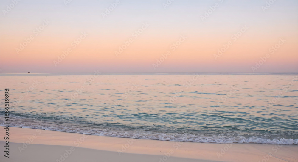 Fototapeta premium Peaceful Beach Sunset with Soft Ocean Waves and Pastel Sky