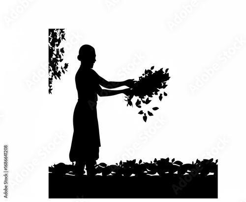 Smiling female worker holding a handful of leaves