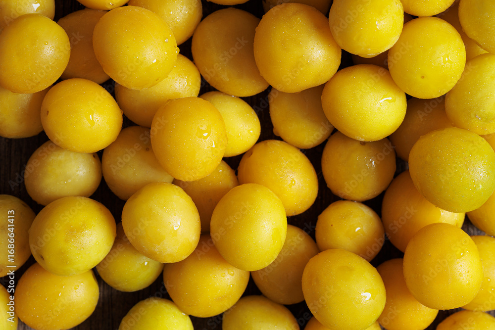 Fresh yellow mirabelle plums close up studio still life Fresh yellow mirabelle plums close up studio still life