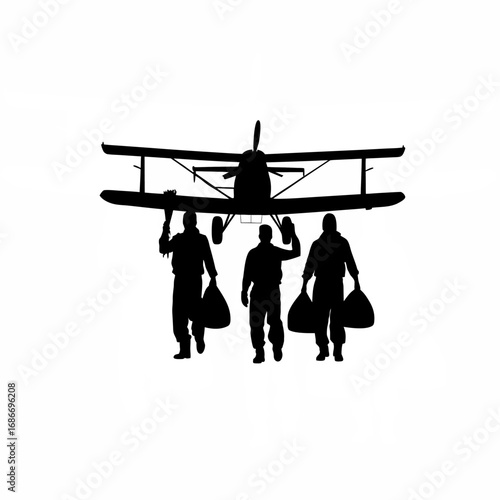 Silhouette of agricultural workers loading seed bags into a crop duster plane