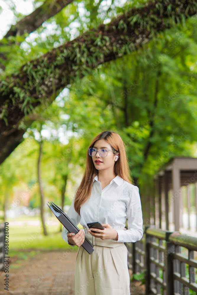 Obraz premium Study of portraits and female students at a university park to learn or study, scholarship books and laptops.