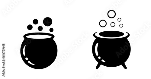 Two black witch cauldrons bubbling with mysterious potion ingredients
